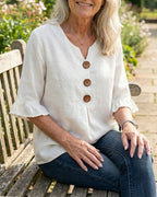 Janet | V-Neck Blouse with Wooden Buttons and Ruffled Sleeves