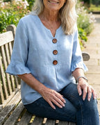 Janet | V-Neck Blouse with Wooden Buttons and Ruffled Sleeves